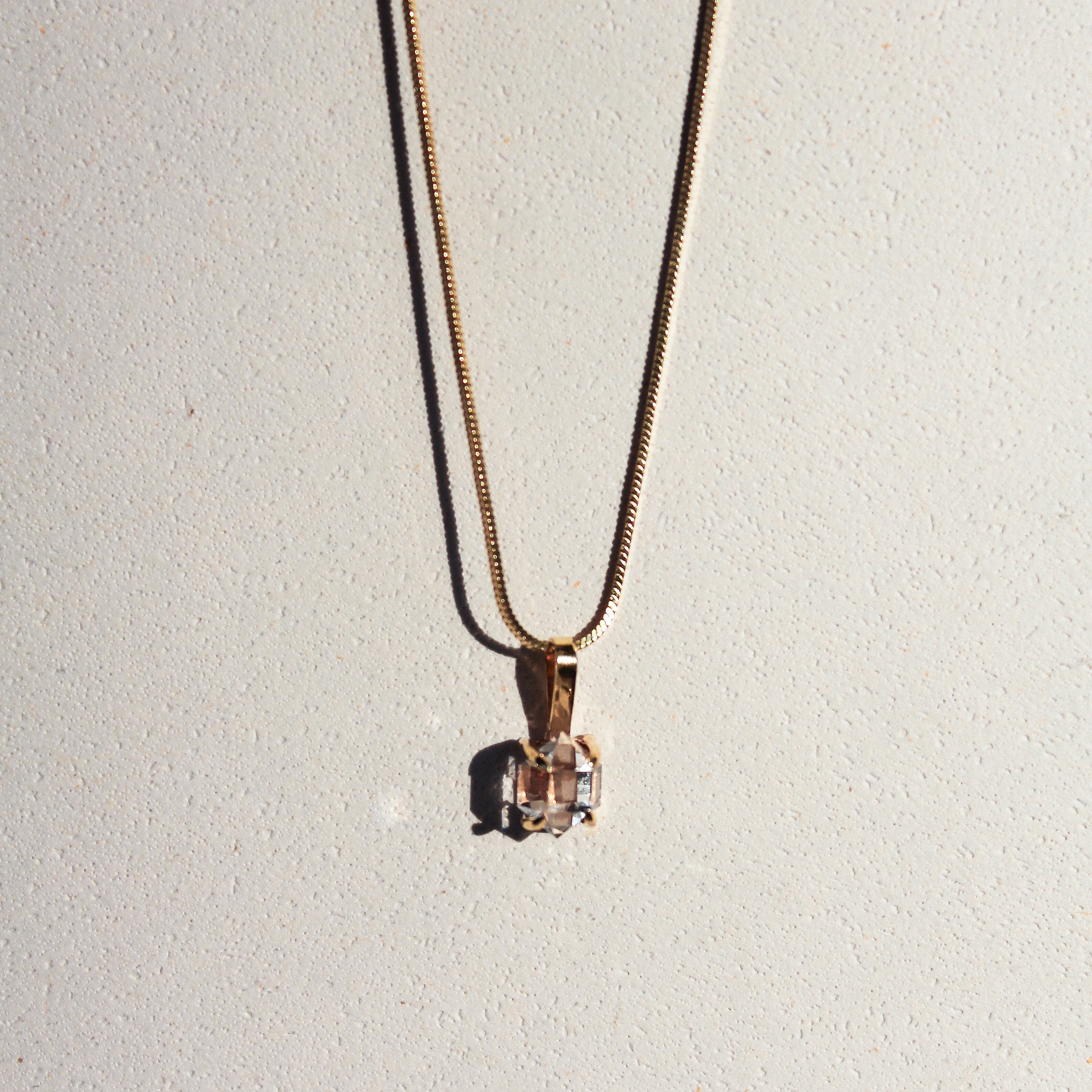 BABY CHARM - CRYSTAL QUARTZ (GOLD-PLATED)